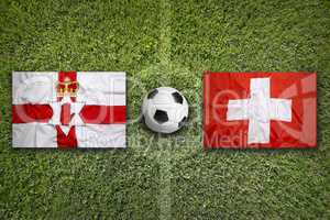 Northern Ireland vs. Switzerland flags on soccer field