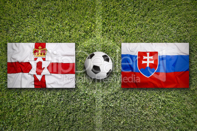 Northern Ireland vs. Slovakia flags on soccer field