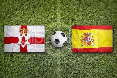 Northern Ireland vs. Spain flags on soccer field