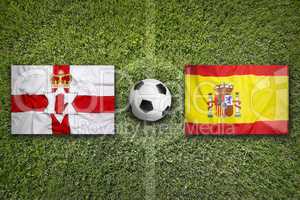 Northern Ireland vs. Spain flags on soccer field