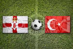 Northern Ireland vs. Turkey flags on soccer field