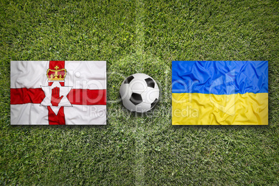 Northern Ireland vs. Ukraine flags on soccer field