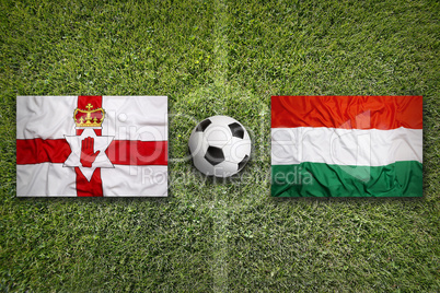 Northern Ireland vs. Hungary flags on soccer field