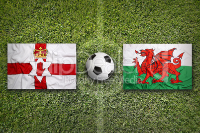 Northern Ireland vs. Wales flags on soccer field