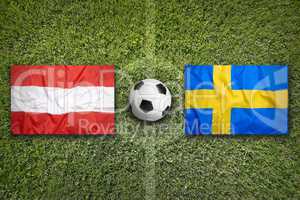 Austria vs. Sweden flags on soccer field