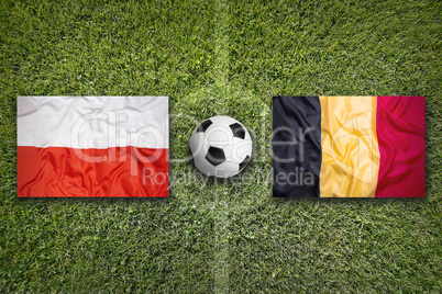 Poland vs. Belgium flags on soccer field