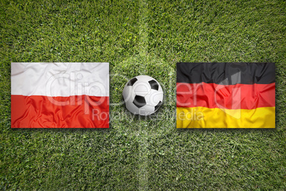 Poland vs. Germany flags on soccer field