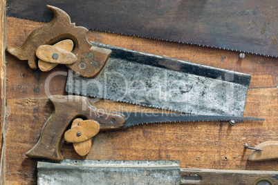 Set of various old and used hand saws