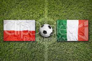 Poland vs. Italy flags on soccer field
