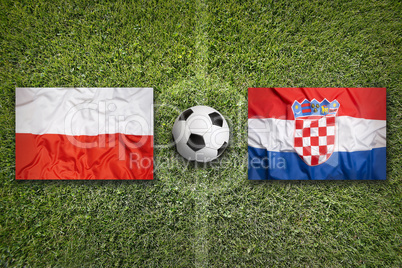 Poland vs. Croatia flags on soccer field