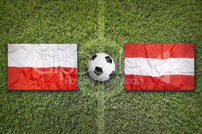 Poland vs. Austria flags on soccer field