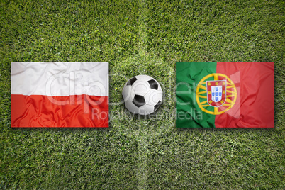 Poland vs. Portugal flags on soccer field