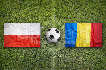 Poland vs. Romania flags on soccer field