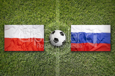 Poland vs. Russia flags on soccer field
