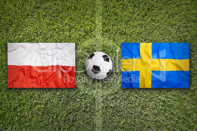 Poland vs. Sweden flags on soccer field