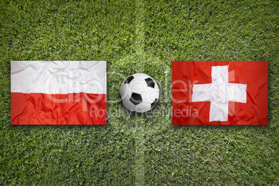 Poland vs. Switzerland flags on soccer field
