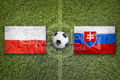 Poland vs. Slovakia flags on soccer field