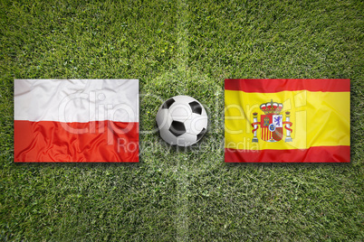 Poland vs. Spain flags on soccer field