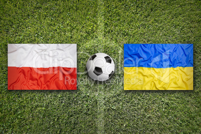 Poland vs. Ukraine flags on soccer field