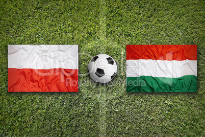 Poland vs. Hungary flags on soccer field