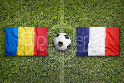 Romania vs. France flags on soccer field