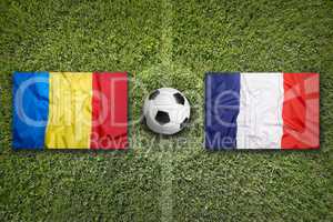 Romania vs. France flags on soccer field