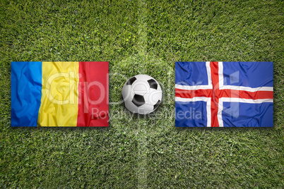 Romania vs. Iceland flags on soccer field