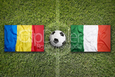 Romania vs. Italy flags on soccer field