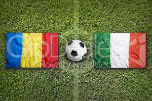 Romania vs. Italy flags on soccer field