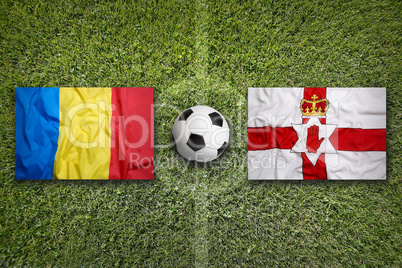 Romania vs. Northern Ireland flags on soccer field