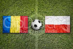 Romania vs. Poland flags on soccer field