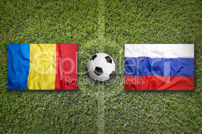 Romania vs. Russia flags on soccer field