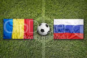 Romania vs. Russia flags on soccer field