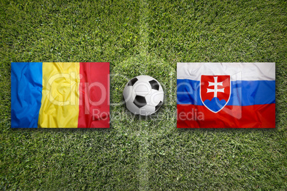 Romania vs. Slovakia flags on soccer field