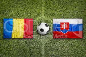 Romania vs. Slovakia flags on soccer field