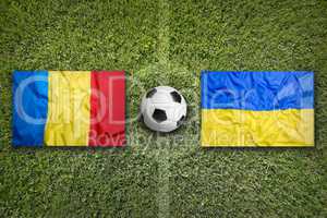 Romania vs. Ukraine flags on soccer field