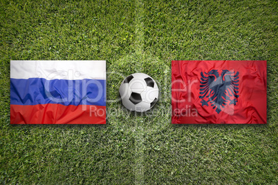 Russia vs. Albania flags on soccer field