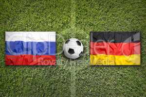 Russia vs. Germany flags on soccer field