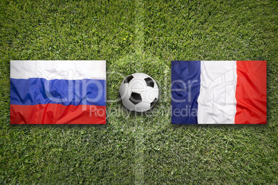 Russia vs. France flags on soccer field