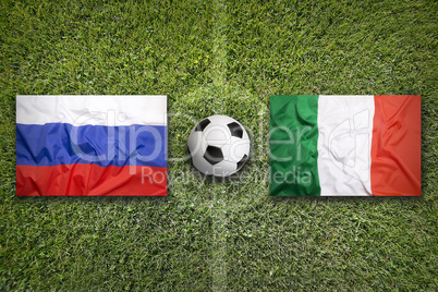 Russia vs. Italy flags on soccer field