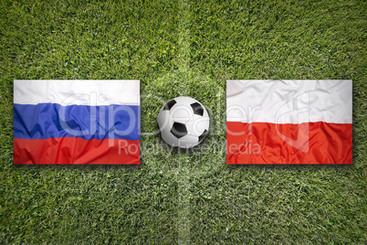 Russia vs. Poland flags on soccer field