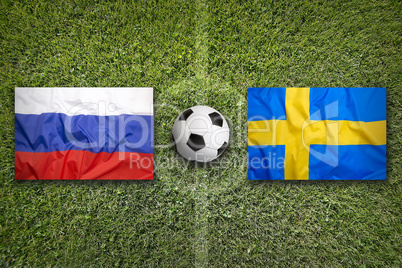 Russia vs. Sweden flags on soccer field