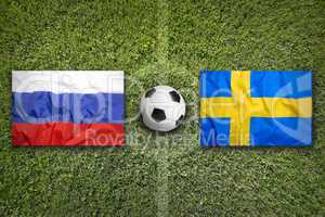 Russia vs. Sweden flags on soccer field