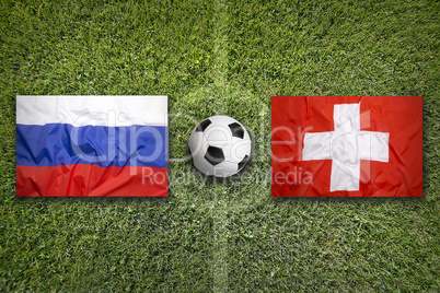 Russia vs. Switzerland flags on soccer field