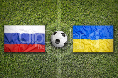 Russia vs. Ukraine flags on soccer field
