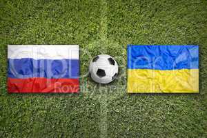 Russia vs. Ukraine flags on soccer field
