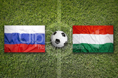 Russia vs. Hungary flags on soccer field