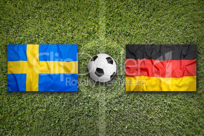 Sweden vs. Germany flags on soccer field