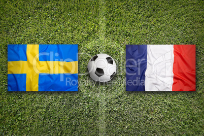 Sweden vs. France flags on soccer field