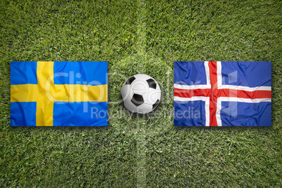 Sweden vs. Iceland flags on soccer field